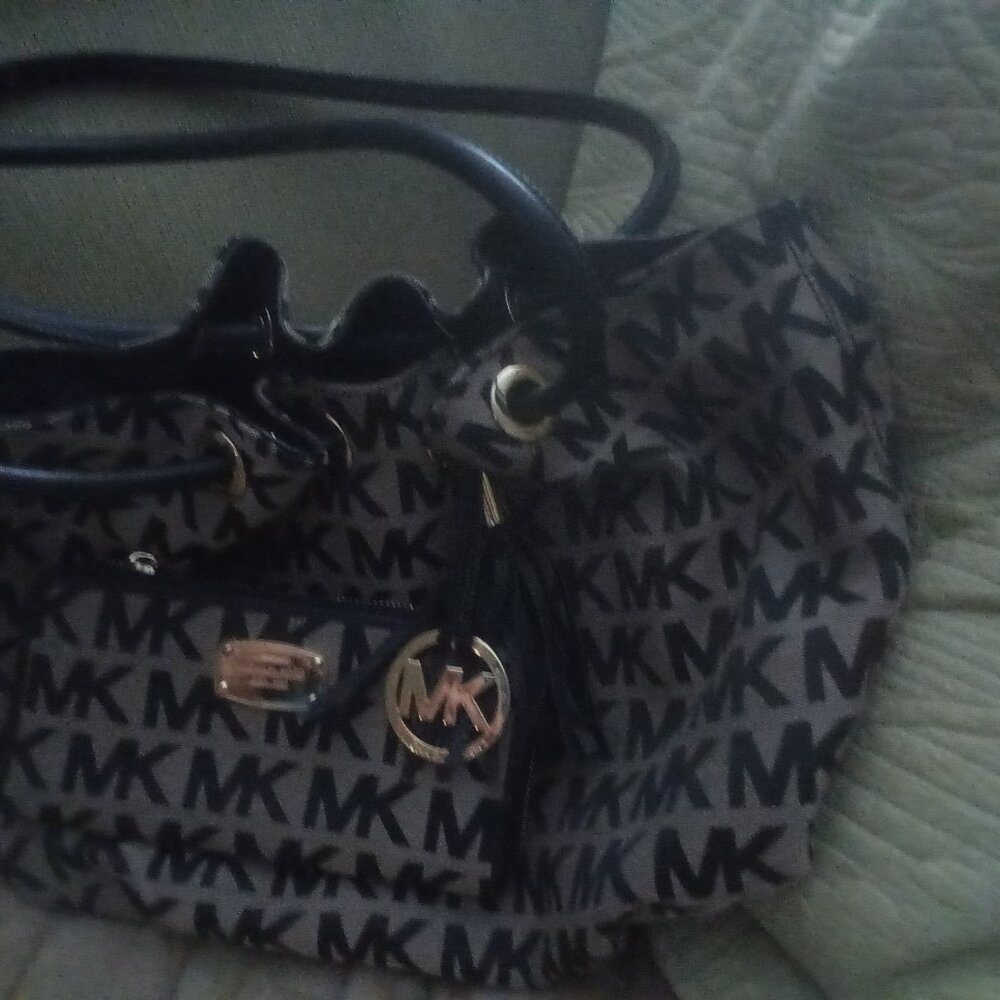 Michaels Kors Cinched bag with matching wallet.